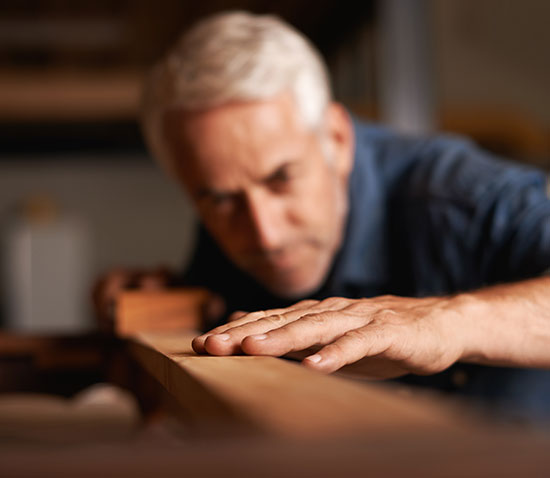 Wood worker applying wood veneer